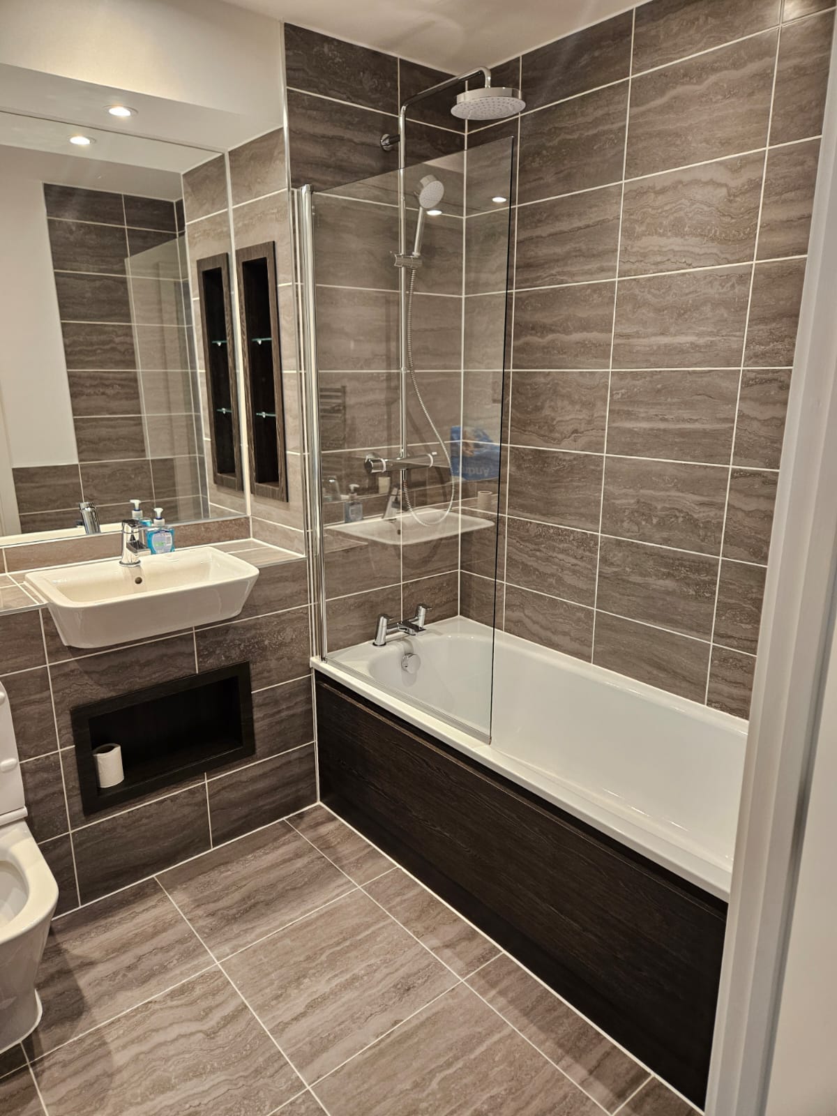 Contemporary grey tiled bathroom renovation