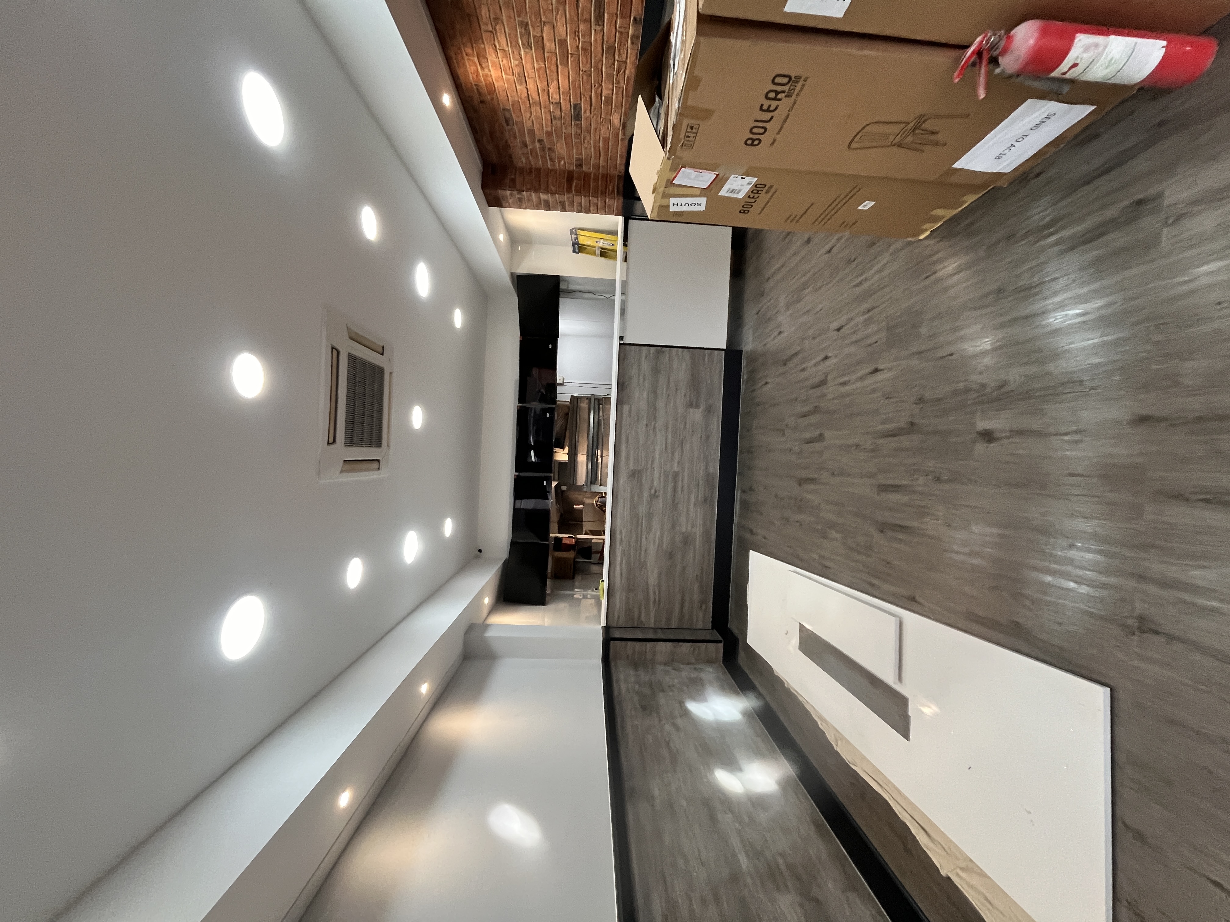 Completed commercial interior with brick feature wall