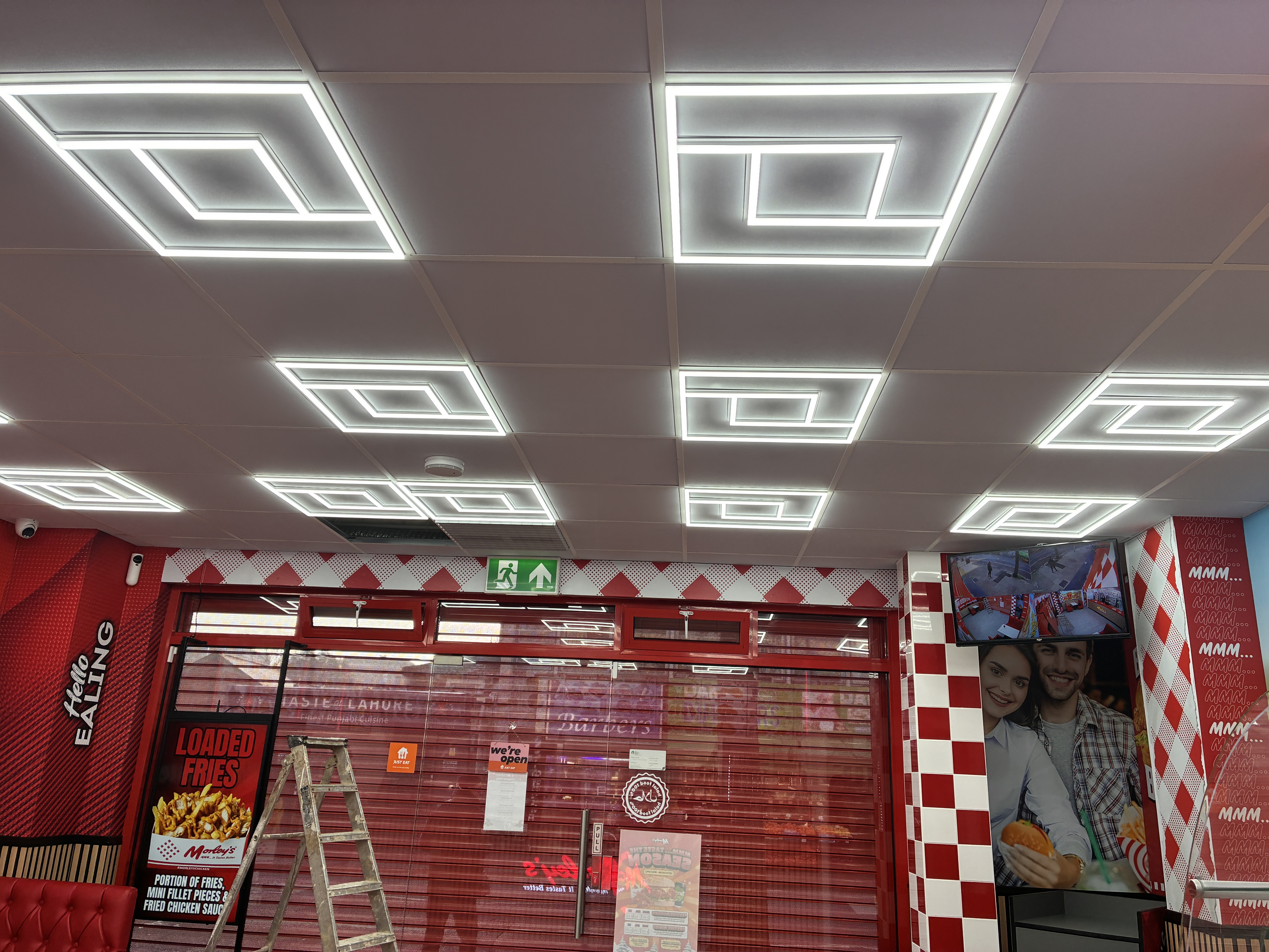 Completed business premises with geometric ceiling lighting