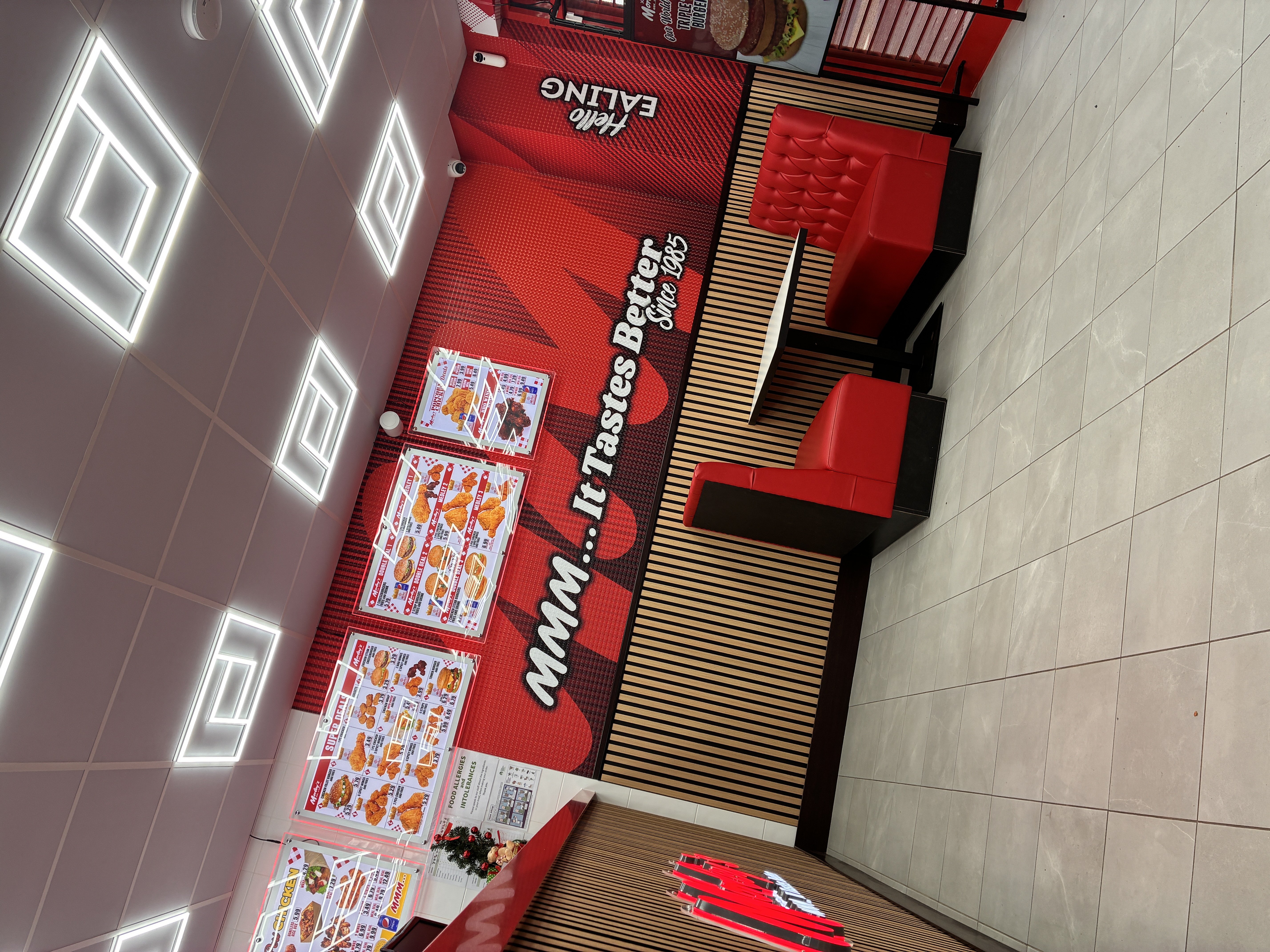 Completed restaurant fit-out with seating and feature wall